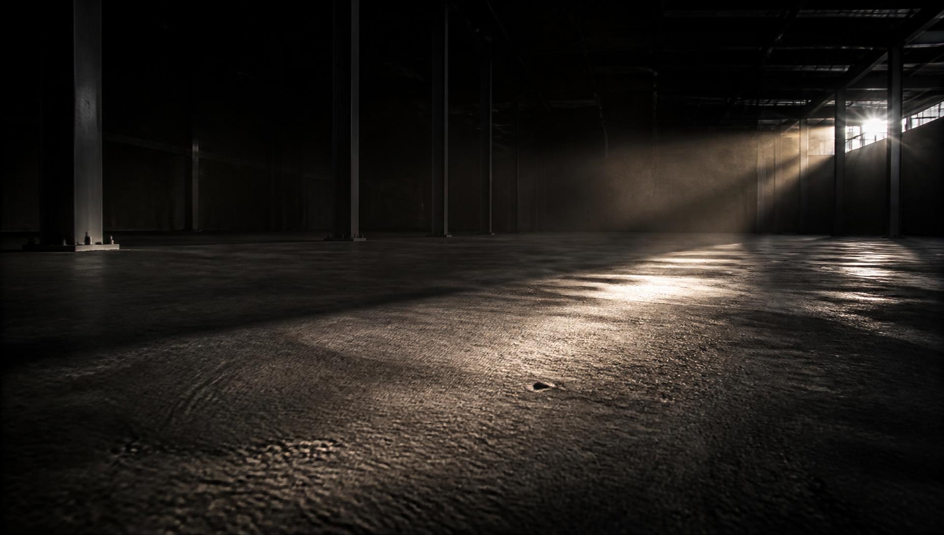 Raking light across a freshly screeded concrete slab on a Build Yogi general contracting site in Ottawa